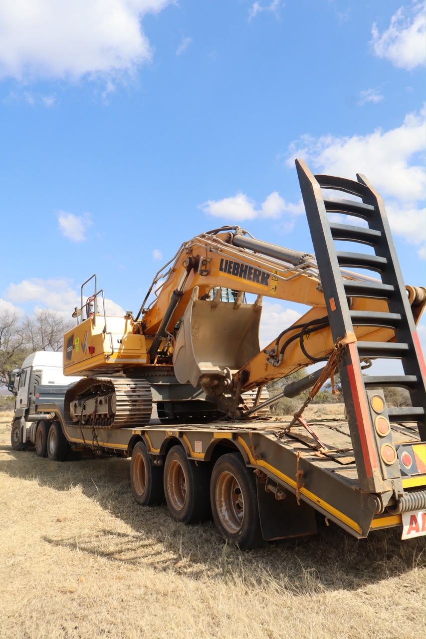 Earthmoving equipment on trailer