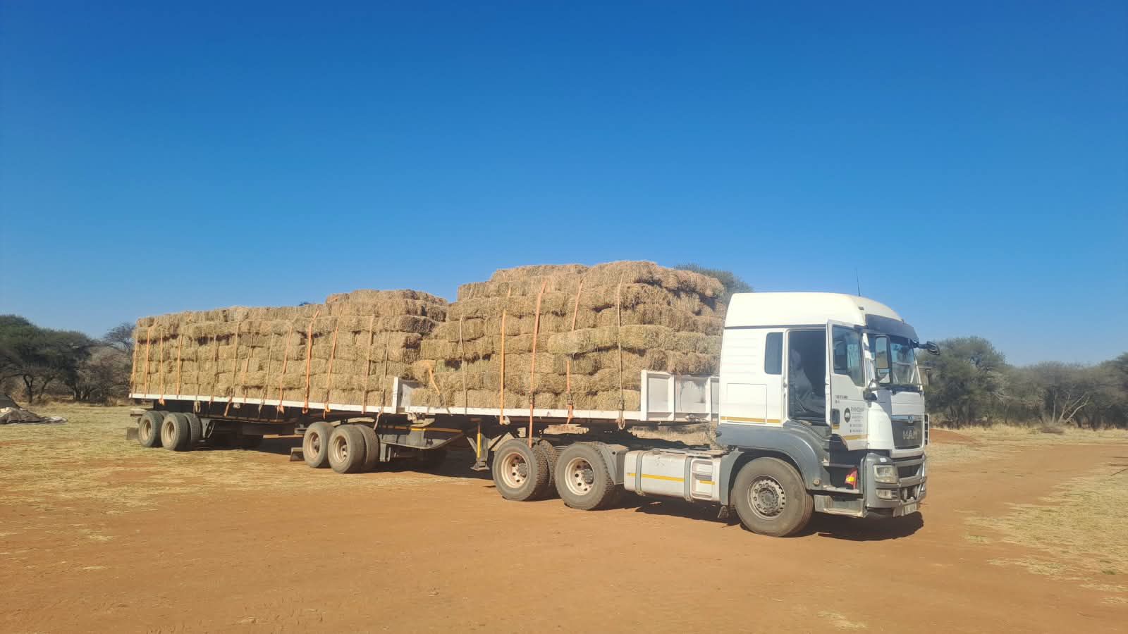 Flatdeck trailer loaded with baled cargo