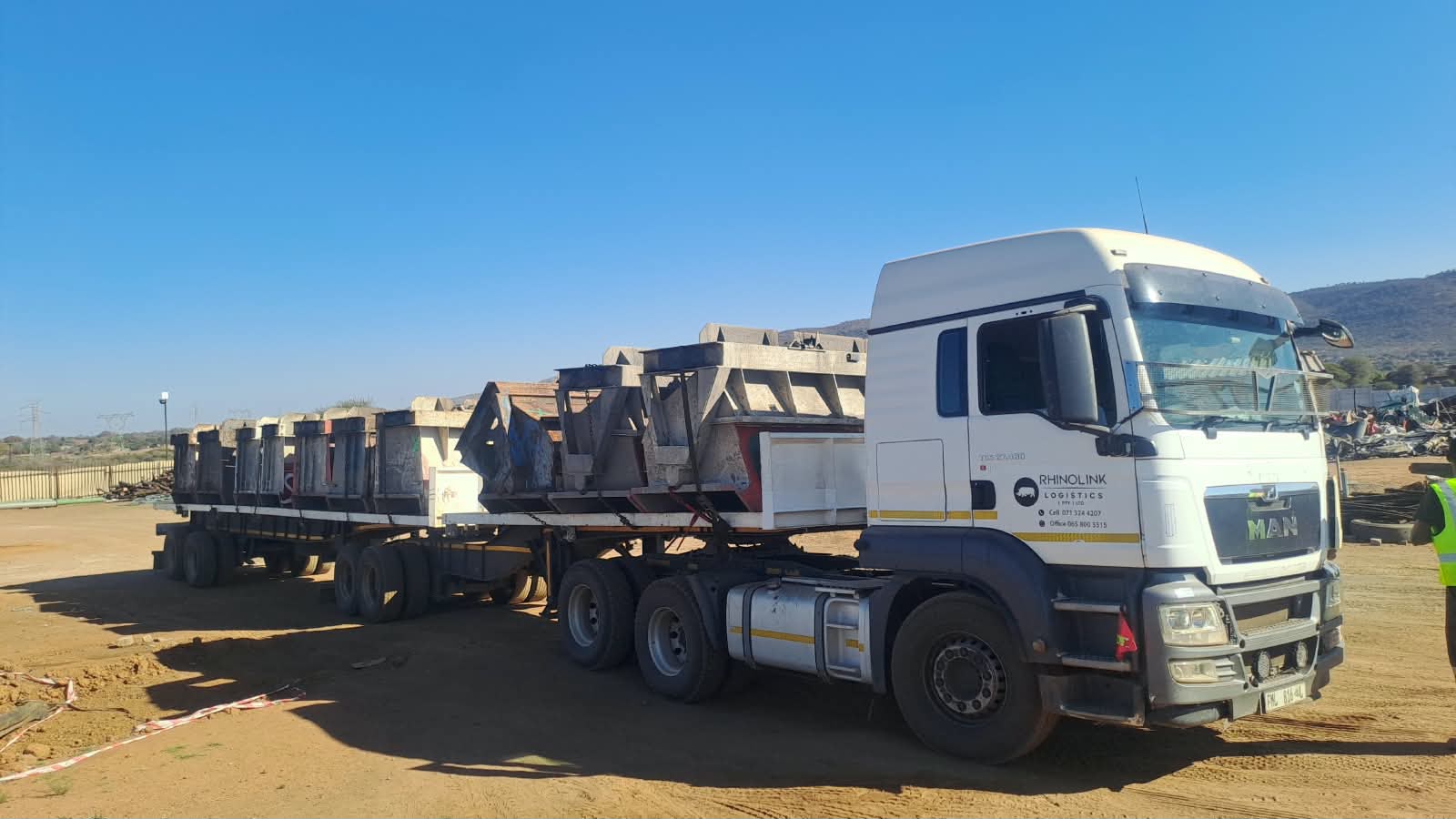 Flatdeck trailer loaded with industrial materials