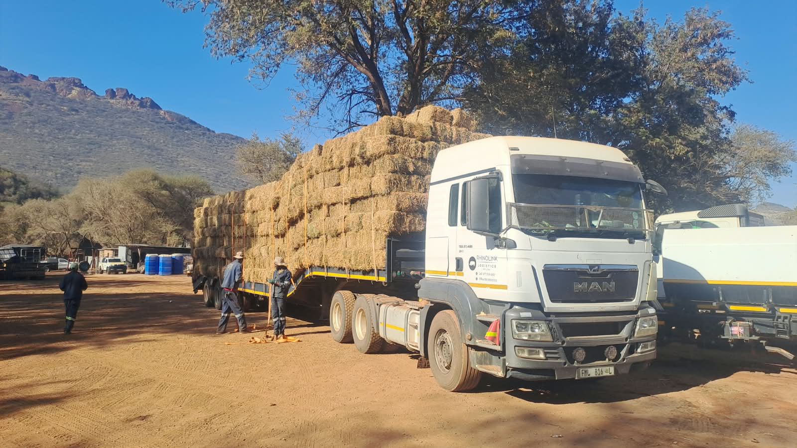 Securing a load of bales in the field